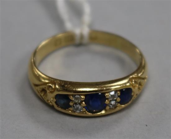 A late Victorian 18ct gold, sapphire and diamond ring, size O.
